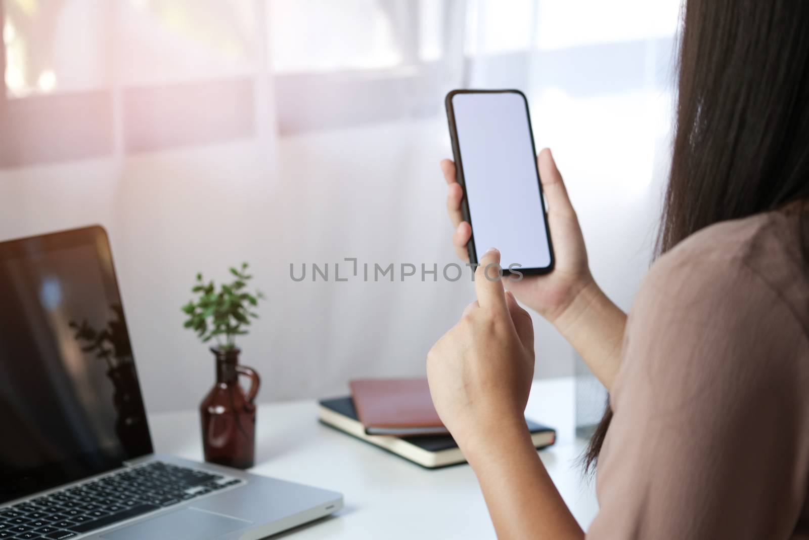 Close up of women's hands holding cell telephone blank copy spac by peandben