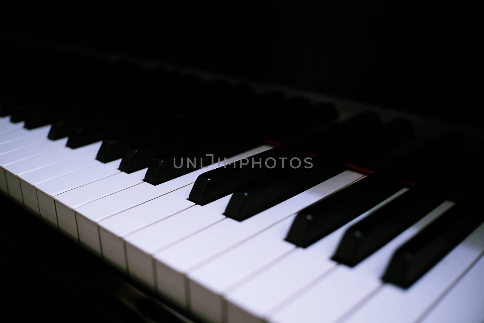 Piano keyboard background with selective focus. by peandben