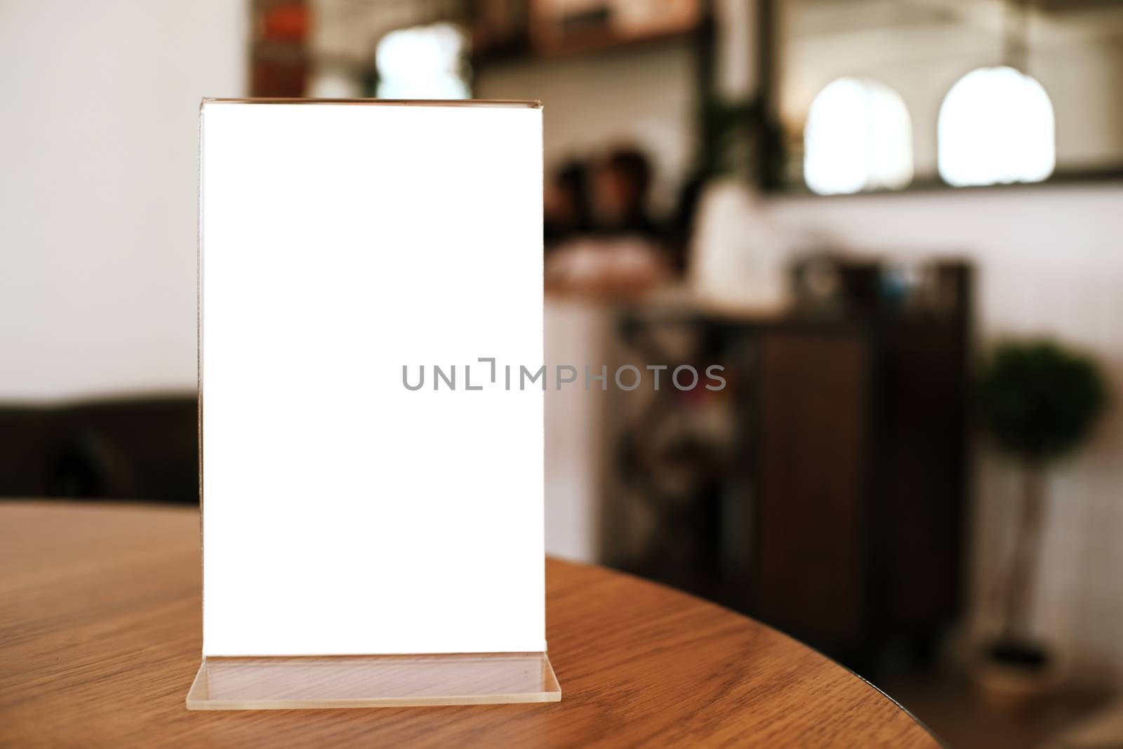 Menu frame standing on wood table in Bar restaurant cafe. space for text marketing promotion