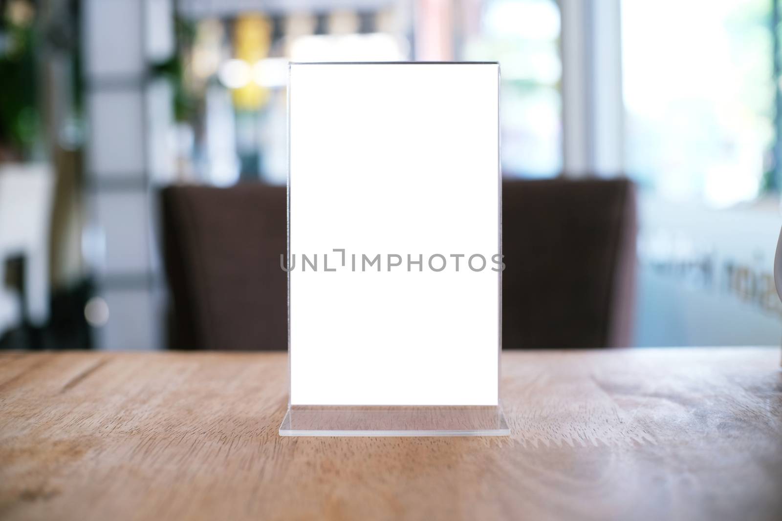 Menu frame standing on wood table in Bar restaurant cafe. space  by peandben