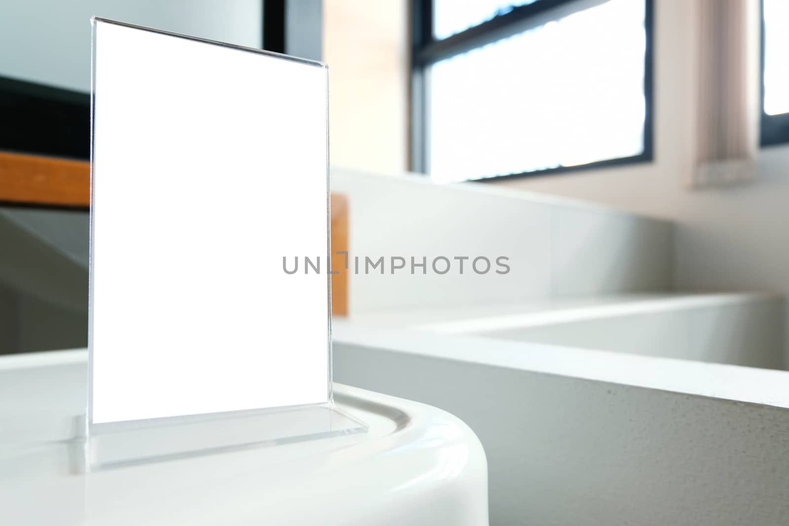 Mock up Menu frame standing on wood table in Bar restaurant cafe by peandben