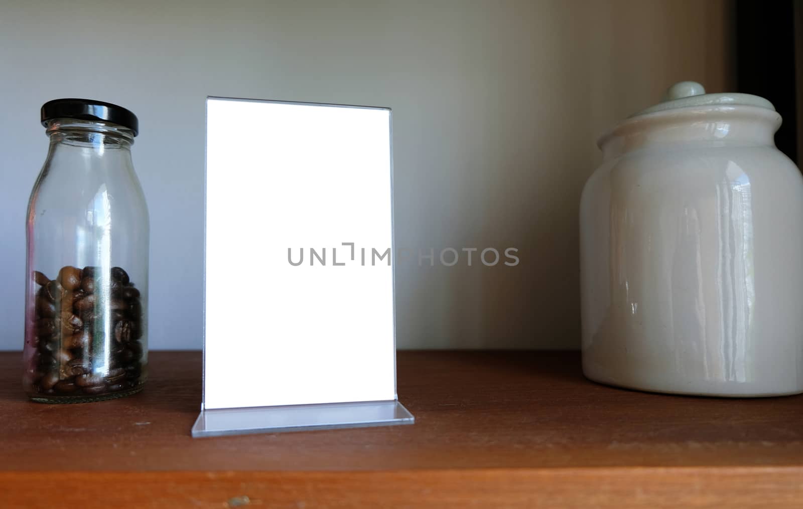 Mock up Menu frame standing on wood table in Bar restaurant cafe by peandben