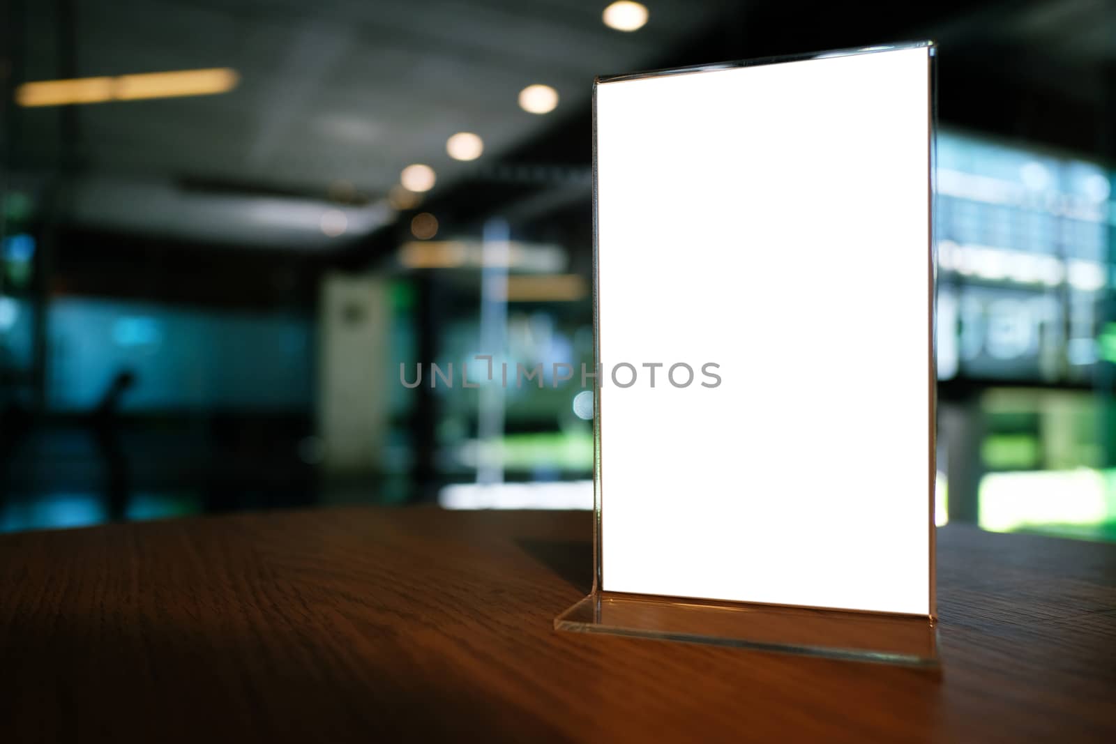 Mock up Menu frame standing on wood table in Bar restaurant cafe by peandben