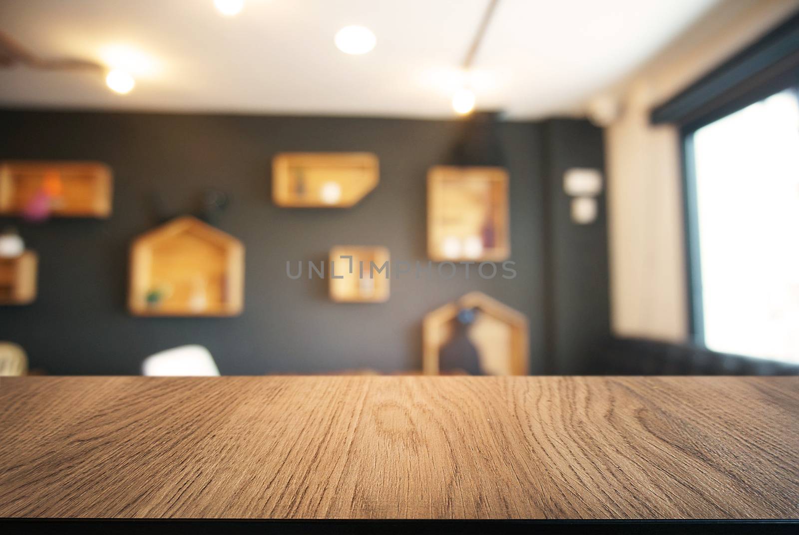 Empty wooden table in front of abstract blurred background of coffee shop . can be used for display or montage your products.Mock up for display of product