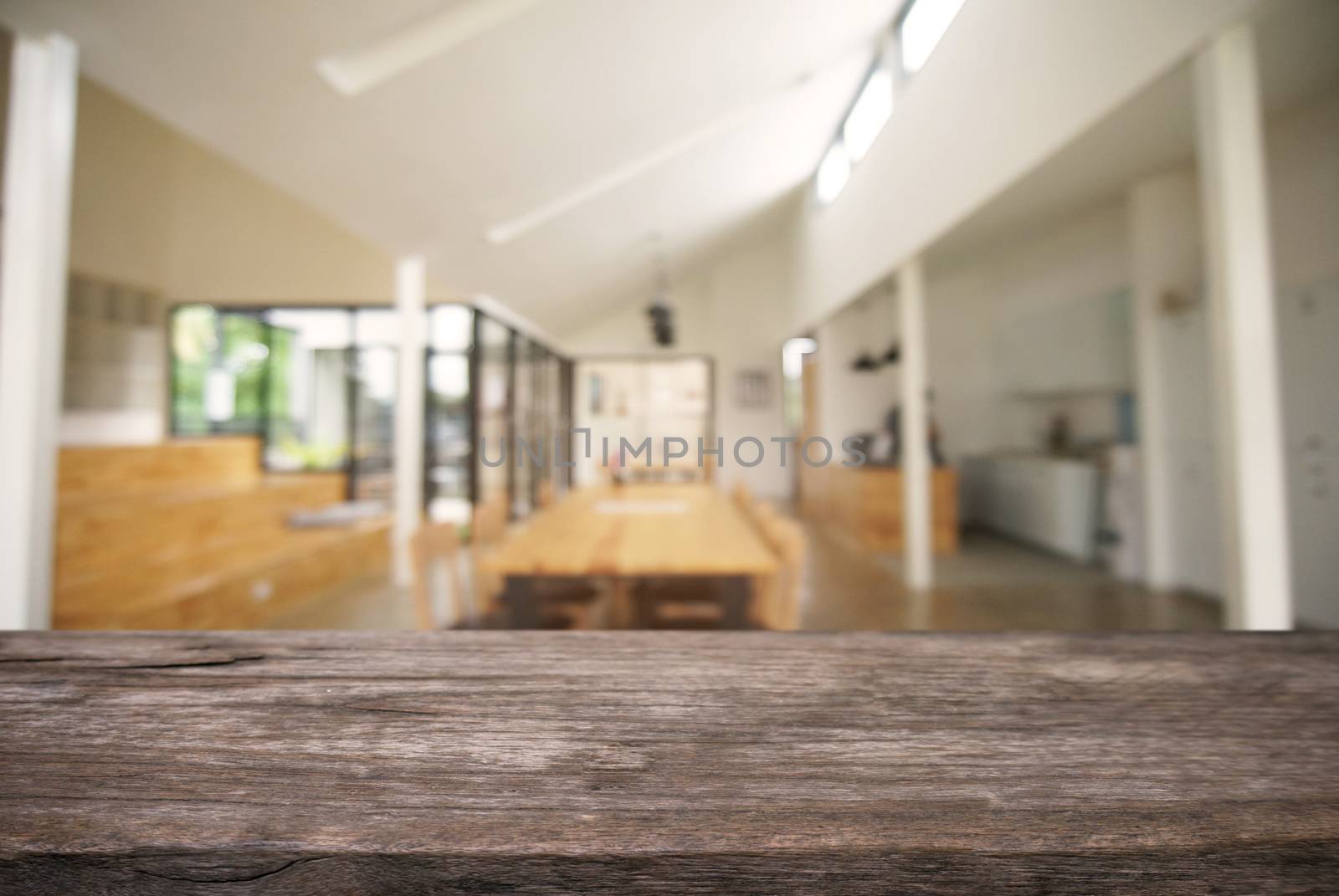 Empty wooden table in front of abstract blurred background of coffee shop . can be used for display or montage your products.Mock up for display of product