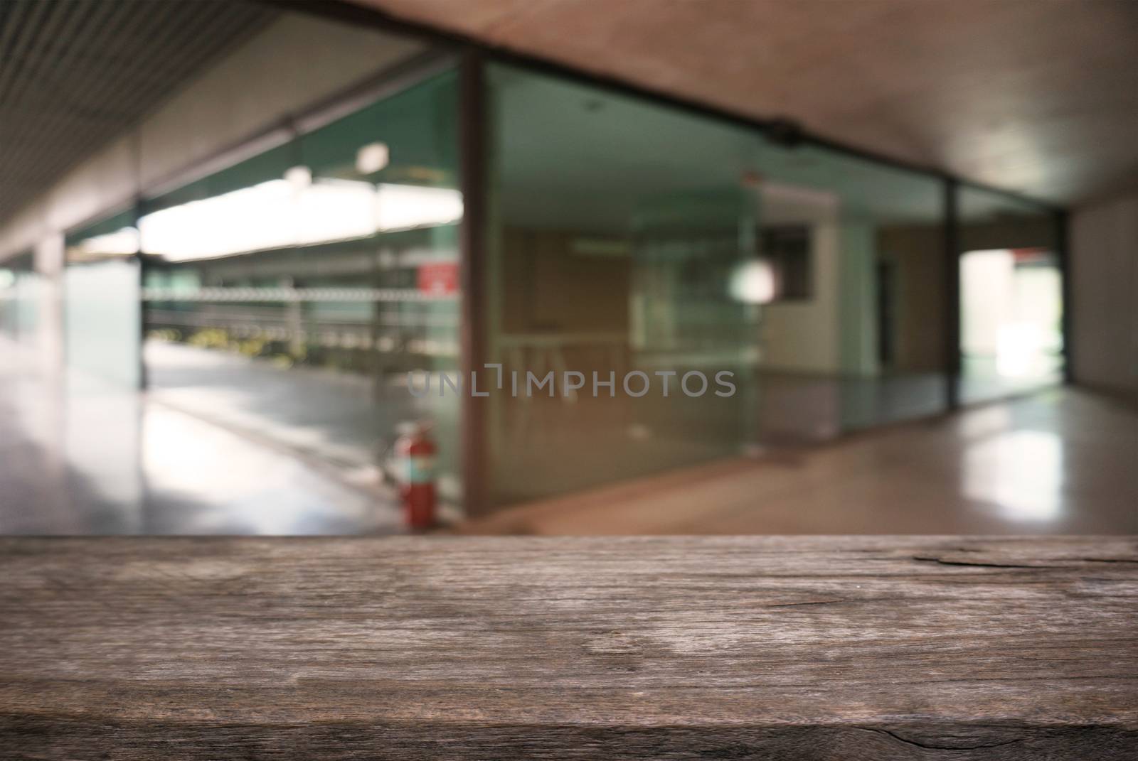 Empty wooden table in front of abstract blurred background of restaurant . can be used for display or montage your products.Mock up for display of counter