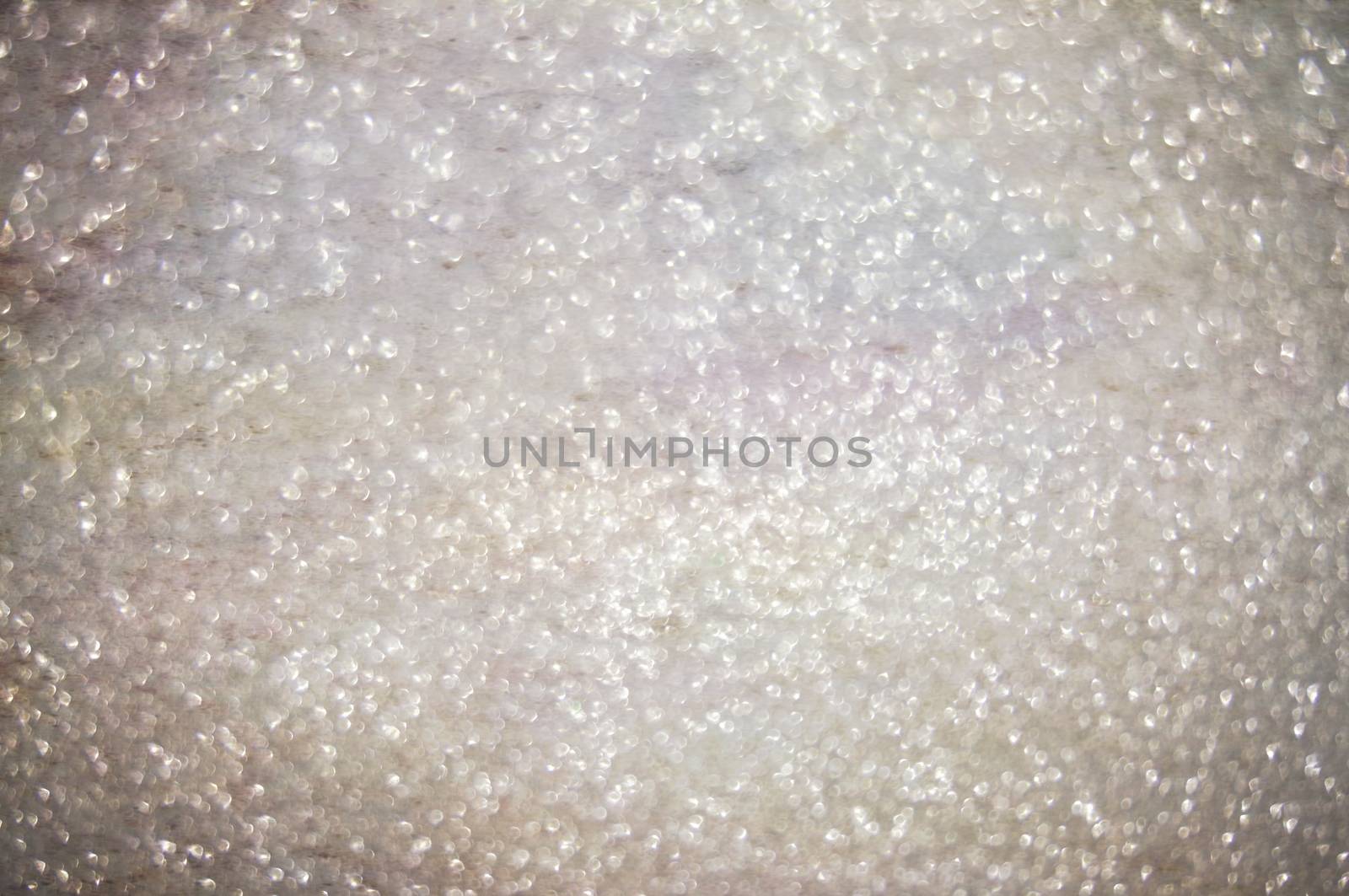 Abstract of shining bokeh glitters for background with copy space. Christmas and New Year wallpaper decorations concept.
