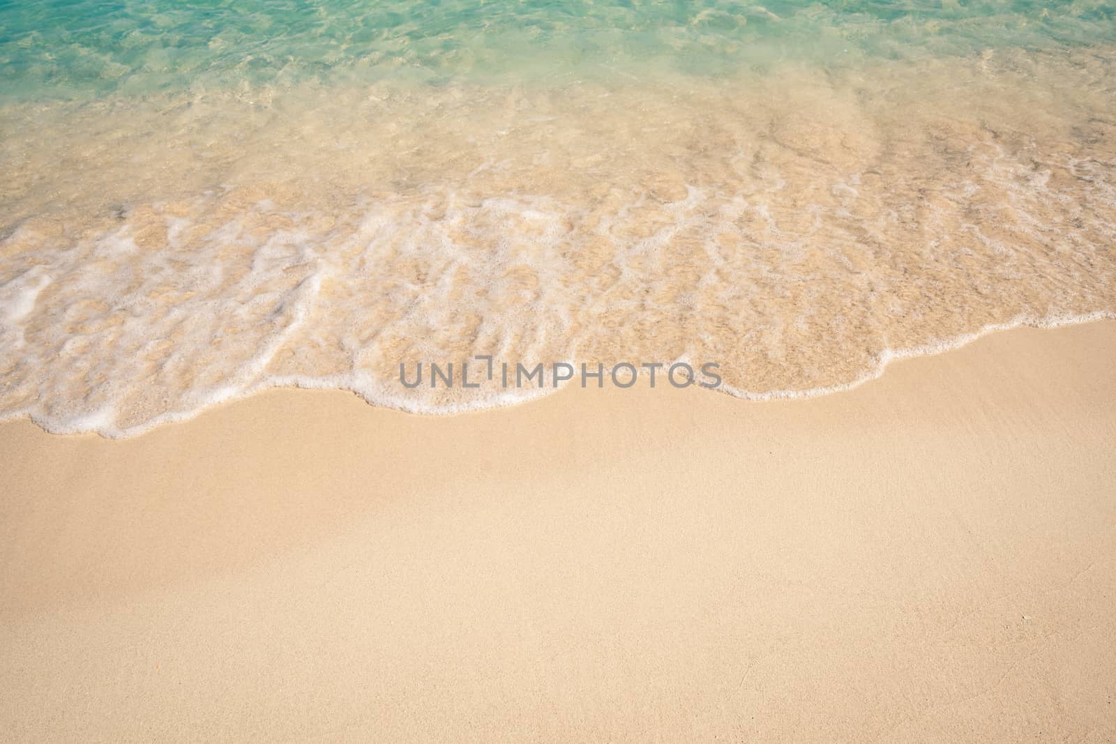 Soft Blue Ocean Wave On Sandy Beach. Background.Caribbean beach.