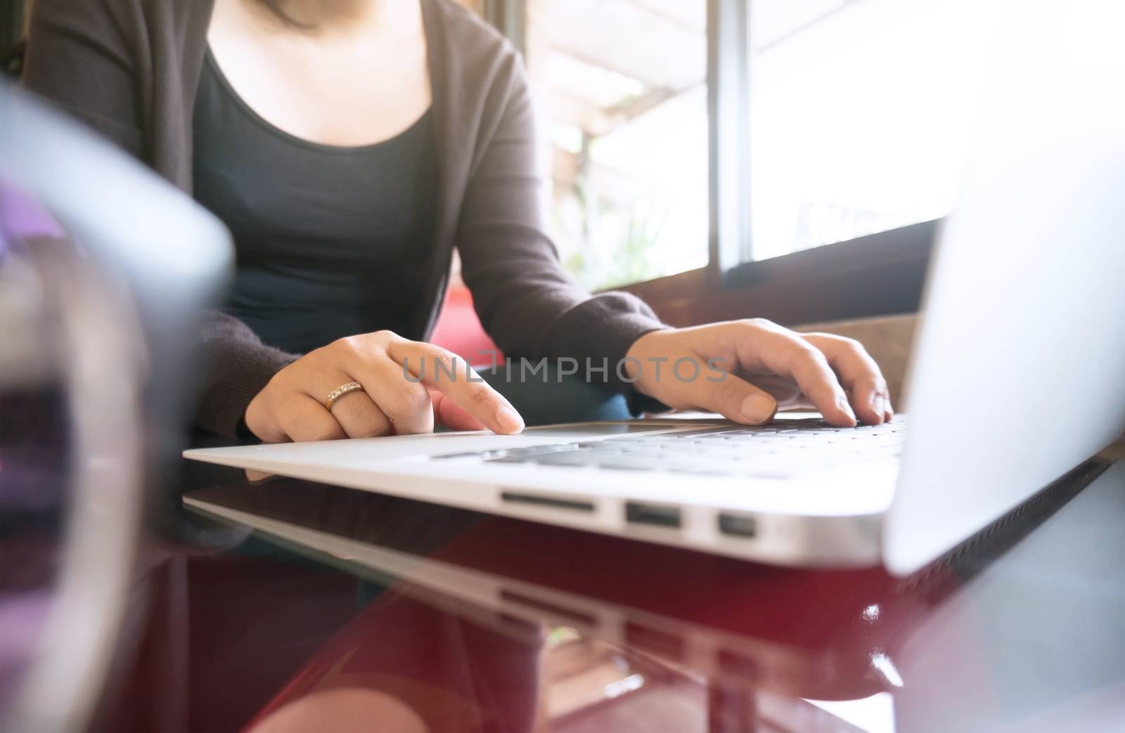 Accountant Working women use calculator with Spreadsheet document information financial concept.