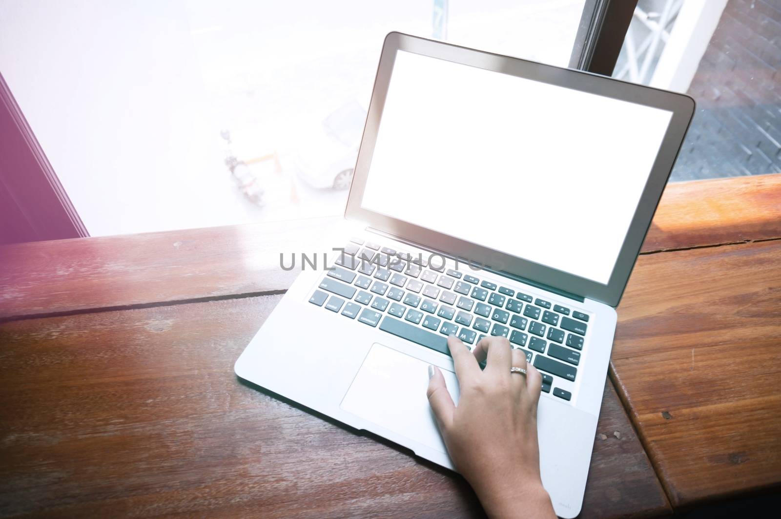 Casual business woman working by using a laptop computer on wood by peandben