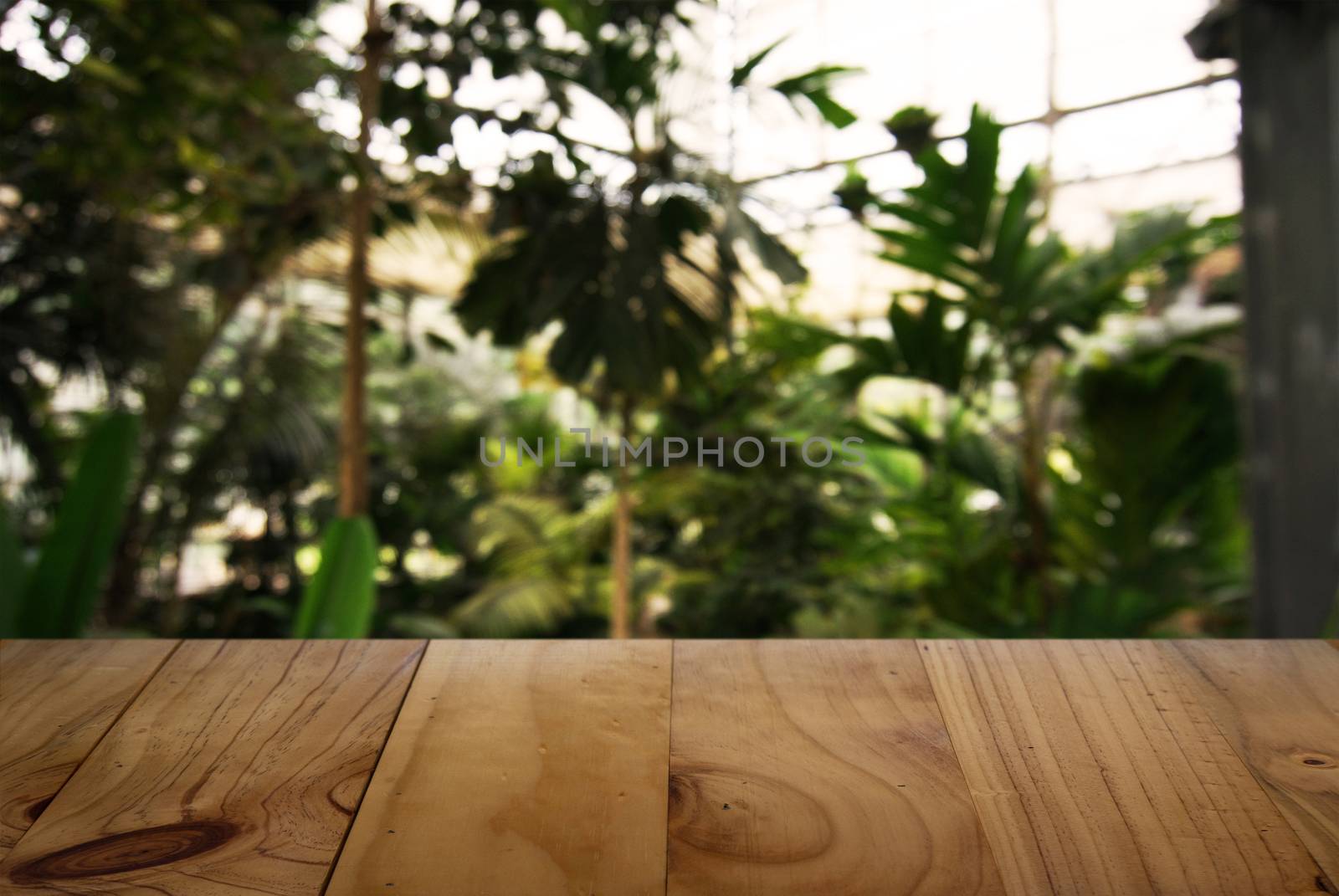 Empty wooden table in front of abstract blurred background of coffee shop . can be used for display Mock up  of product.