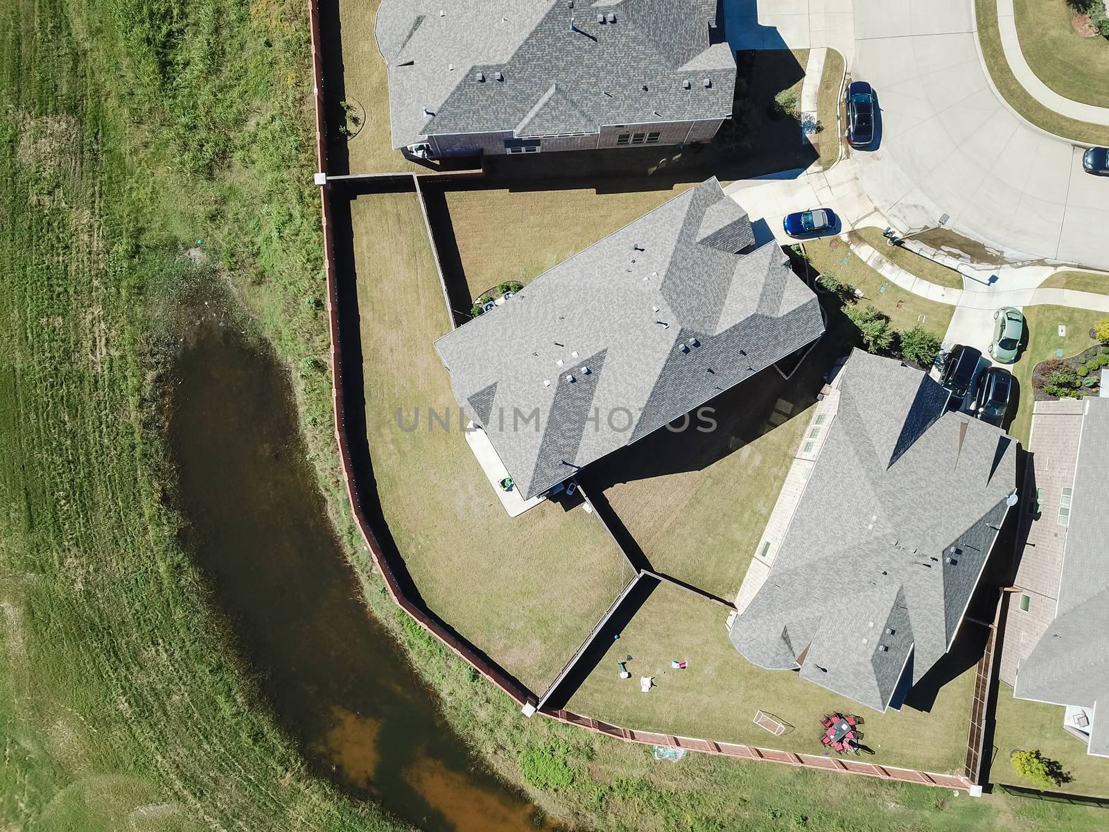 Aerial straight down view of brand new single-family houses with garden, wooden fence near Dallas, Texas, USA