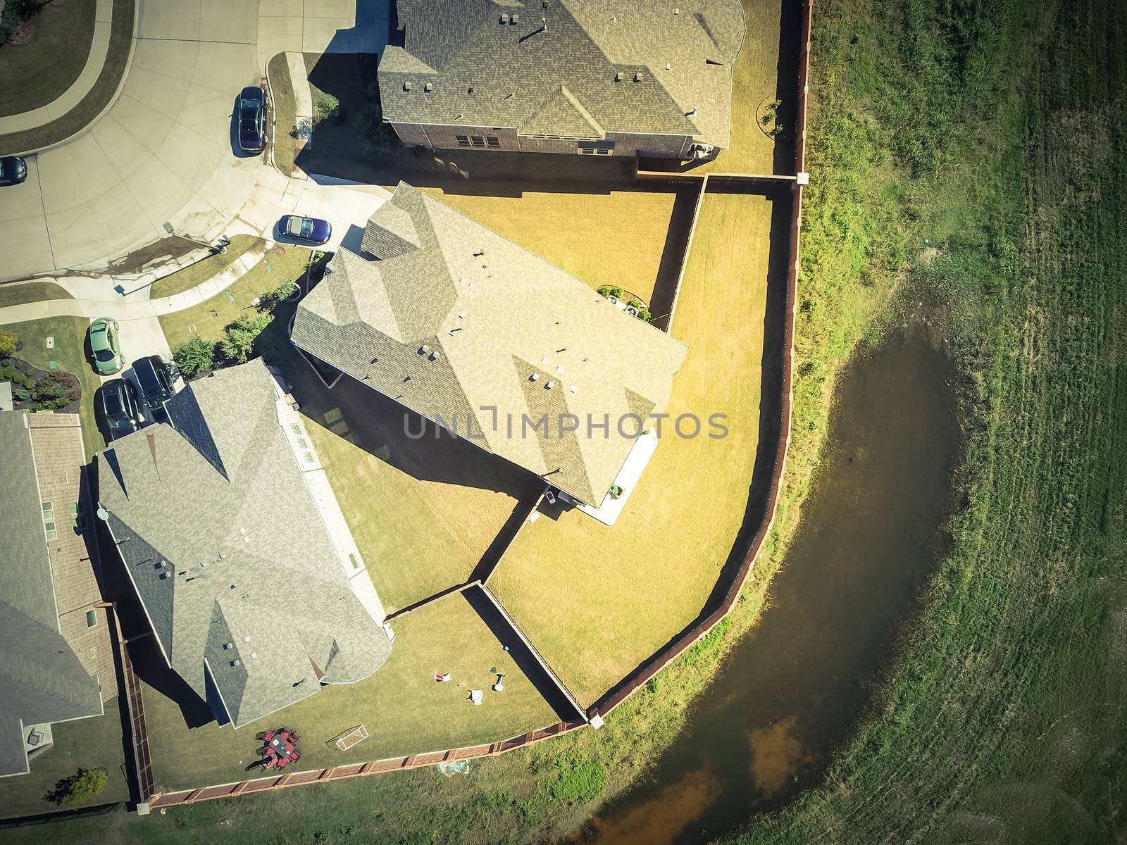 Aerial straight down view of brand new single-family houses with garden, wooden fence near Dallas, Texas, USA