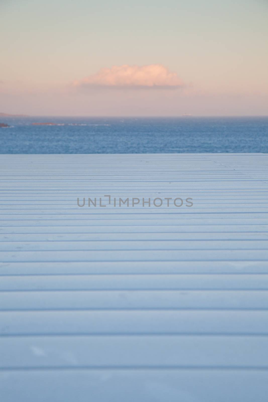 white wooden planks, sunset sky. sea