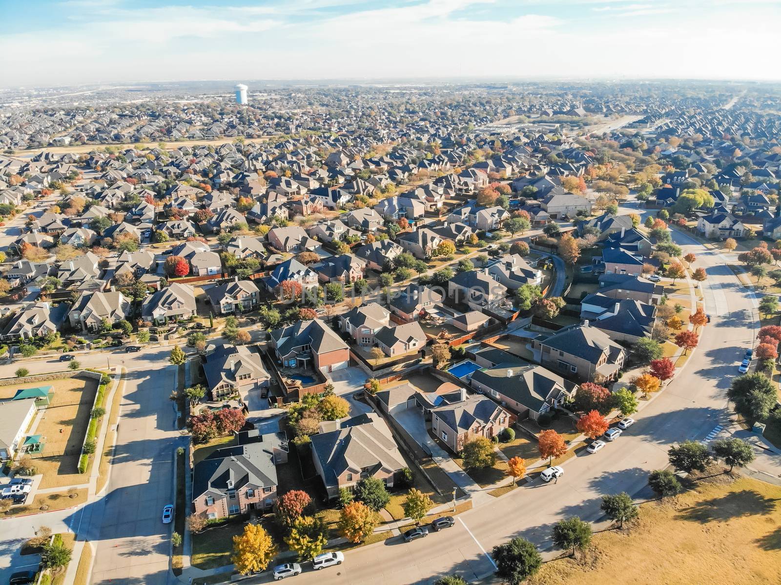 Aerial view new development neighborhood in Cedar Hill, Texas, USA in morning fall with colorful leaves. A city in Dallas and Ellis counties located approximately 16 miles southwest of downtown Dallas