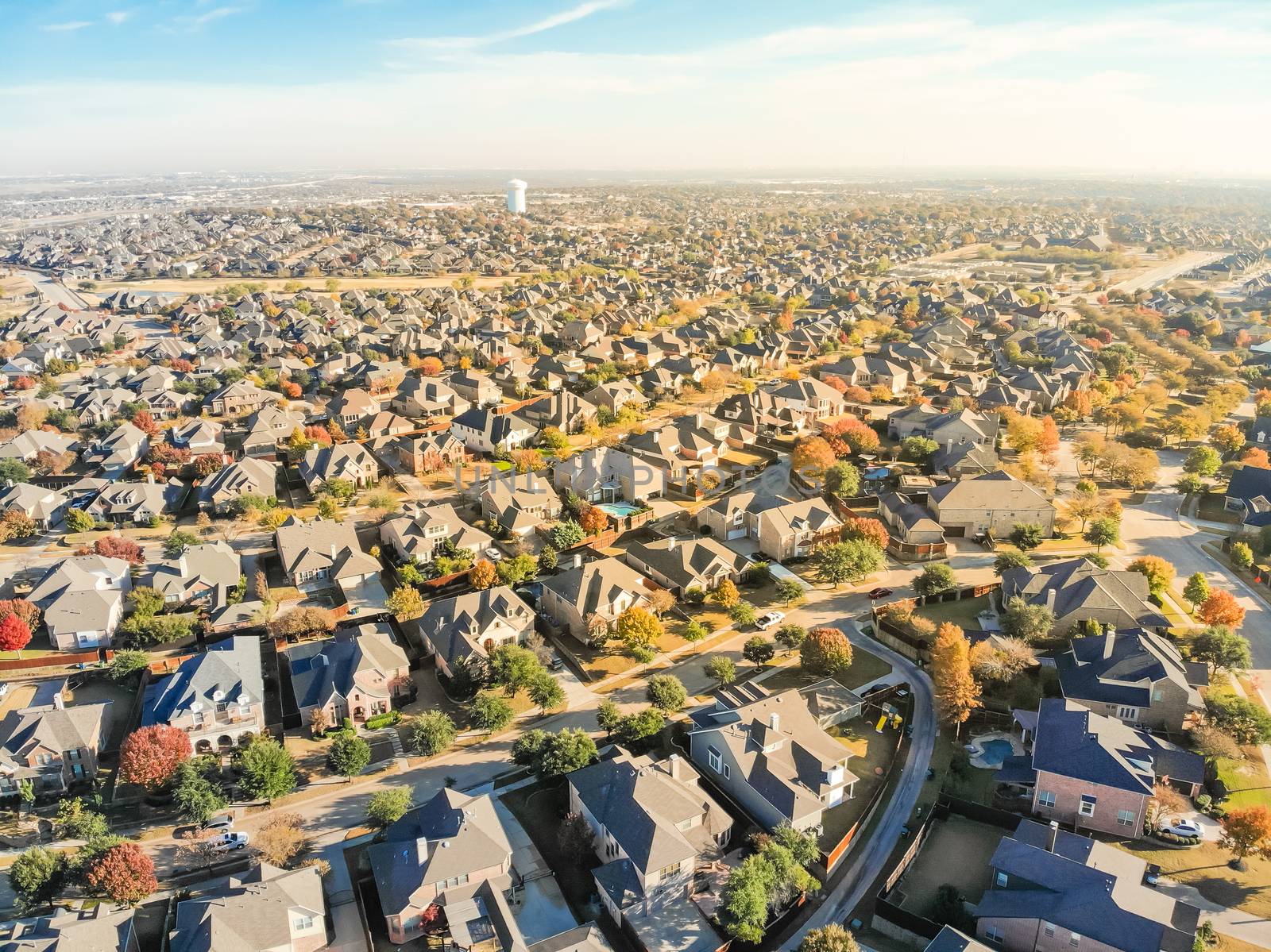 Aerial view new development neighborhood in Cedar Hill, Texas, USA in morning fall with colorful leaves. A city in Dallas and Ellis counties located approximately 16 miles southwest of downtown Dallas