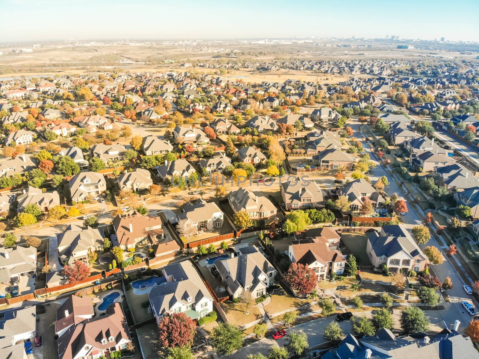 Aerial view new development neighborhood in Cedar Hill, Texas, USA in morning fall with colorful leaves. A city in Dallas and Ellis counties located approximately 16 miles southwest of downtown Dallas