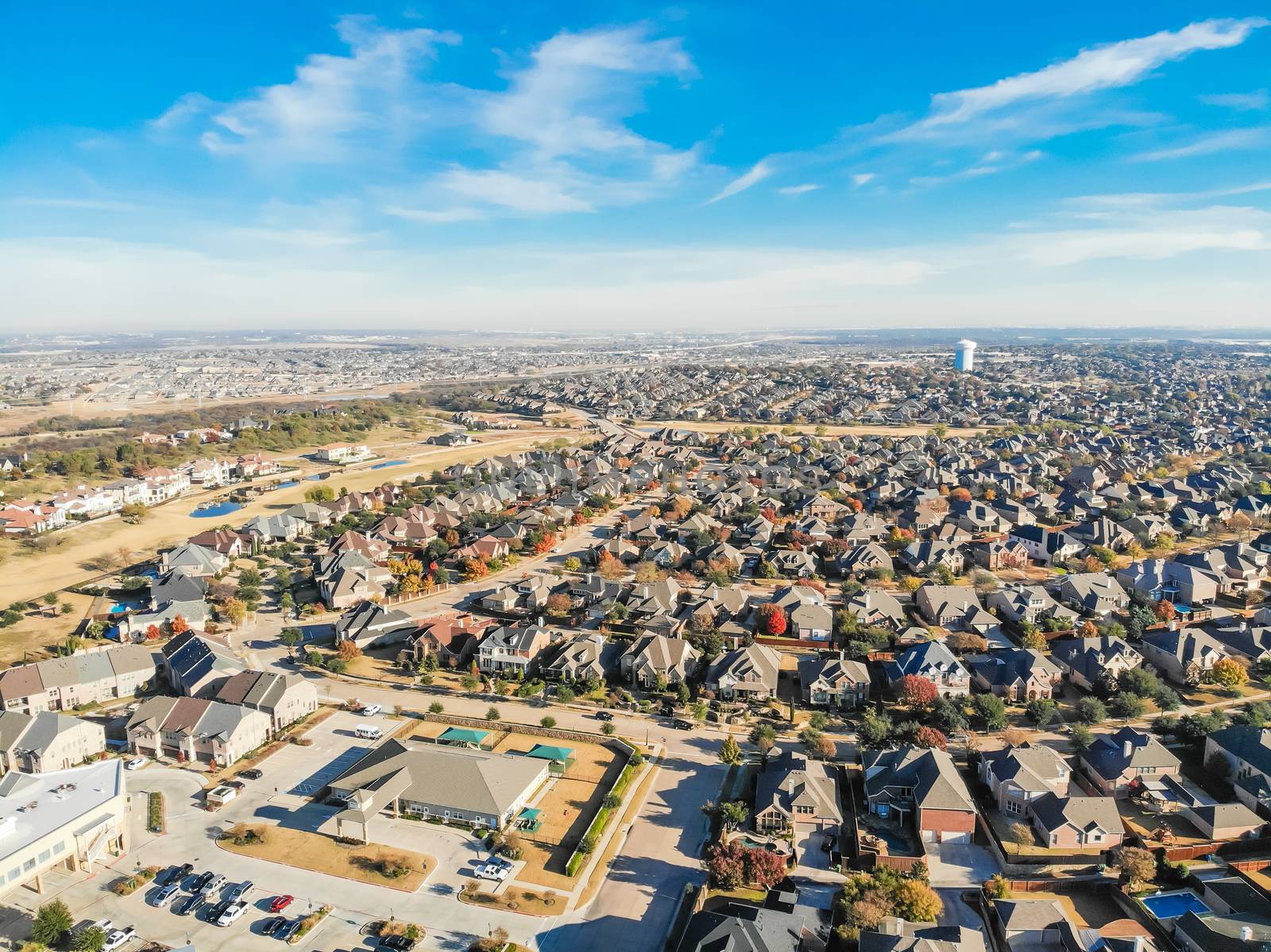 Aerial view new development neighborhood in Cedar Hill, Texas, USA in morning fall with colorful leaves. A city in Dallas and Ellis counties located approximately 16 miles southwest of downtown Dallas