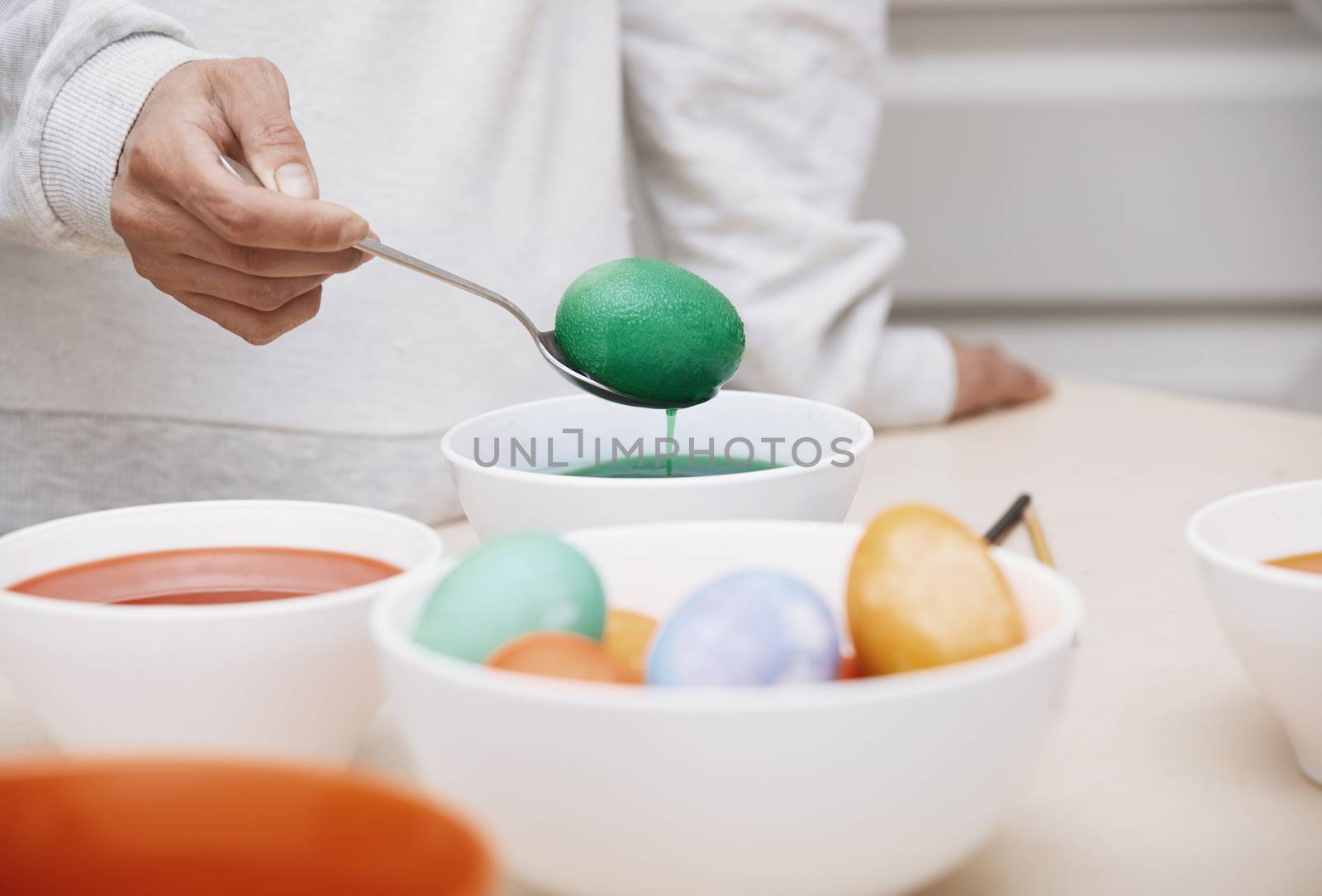 Woman preparing Easter eggs by Novic