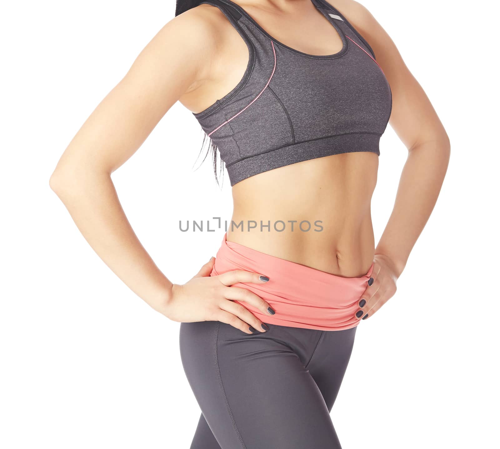 Fitness woman posing on a white background by Novic
