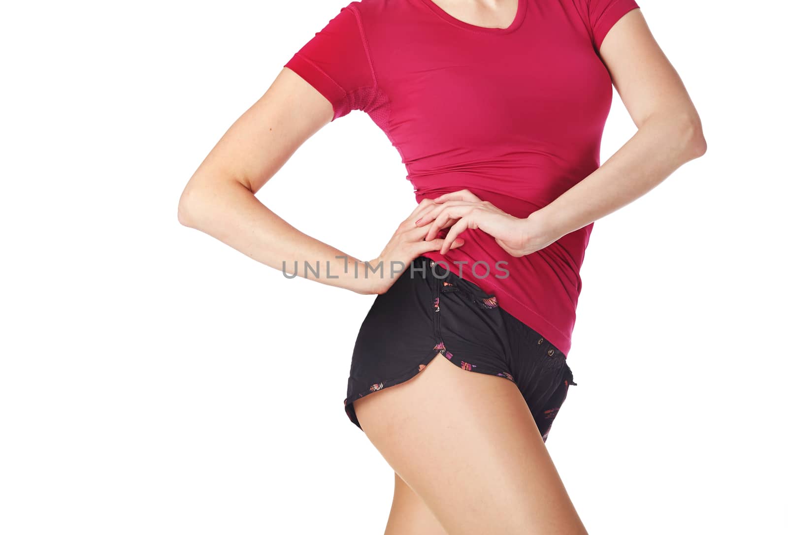 Fitness woman posing on a white background by Novic