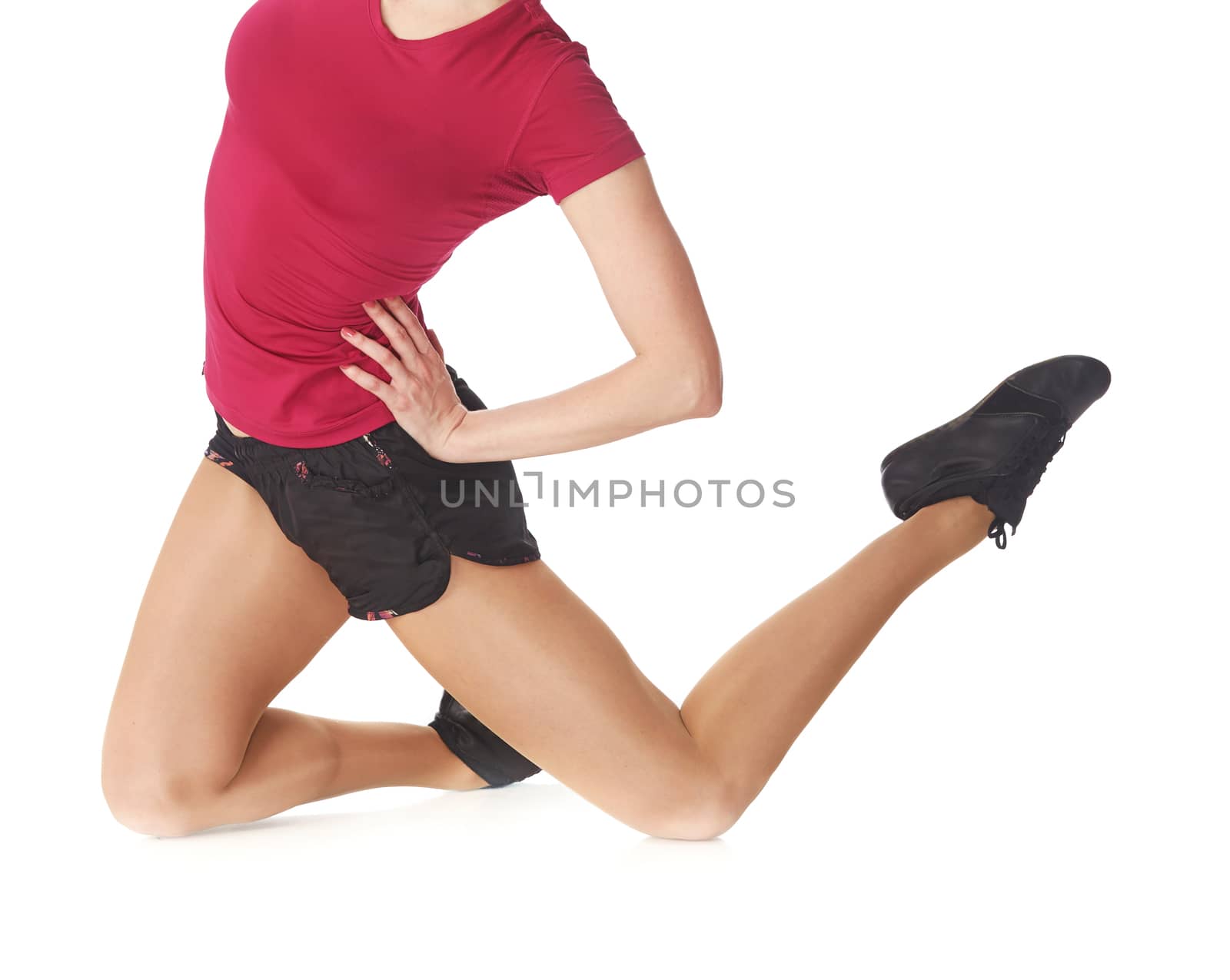 Sportive woman jumping in studio on a white background