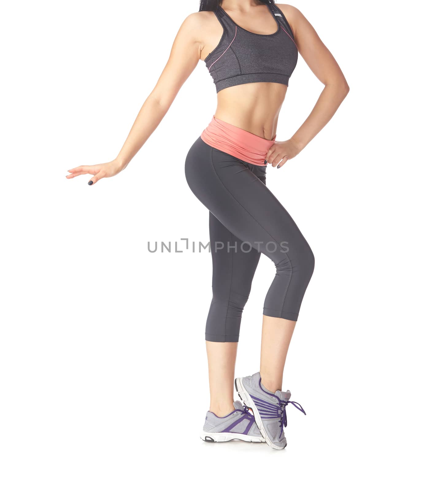 Low section of sportive woman on a white background