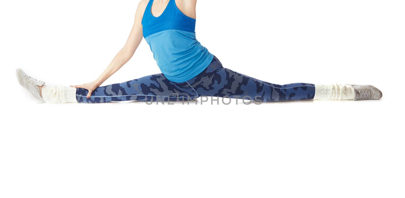 Woman doing fitness execrise on a white studio background