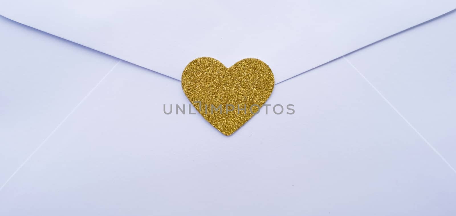 Valentine's day love letter envelope with hearts on wooden backg by peandben