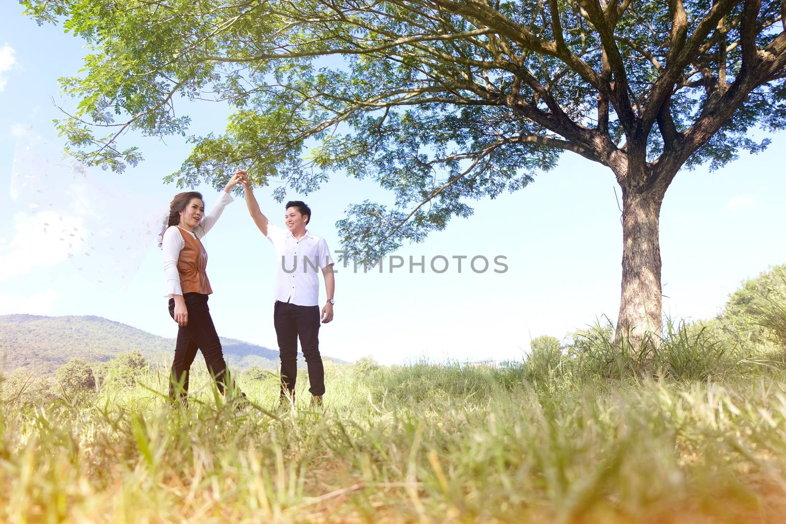 Young couple dancing in the park. Romantic honeymoon. travel valentine