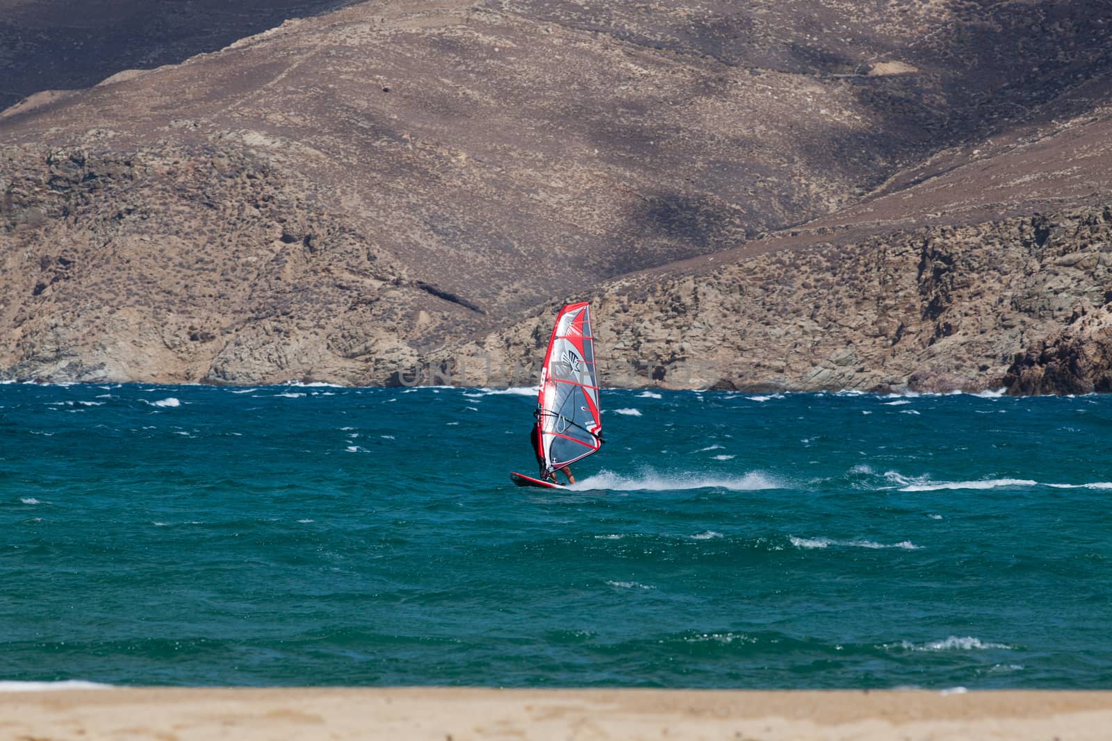 kite surfing on blue waves