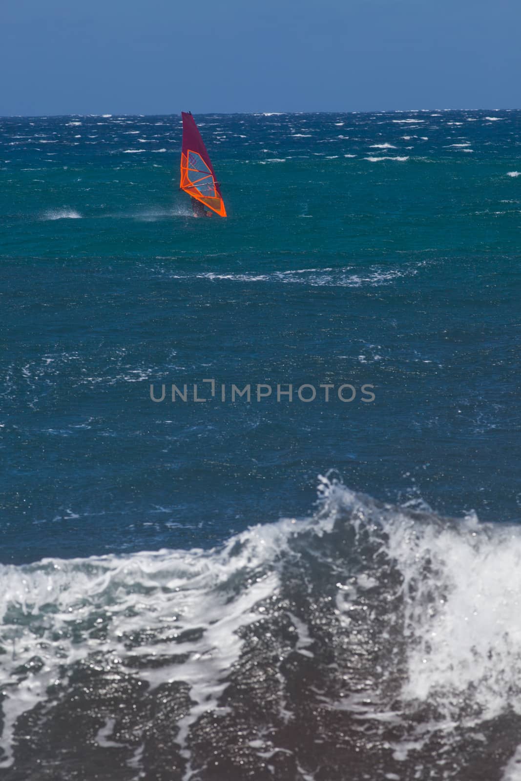 kite surfing on blue waves