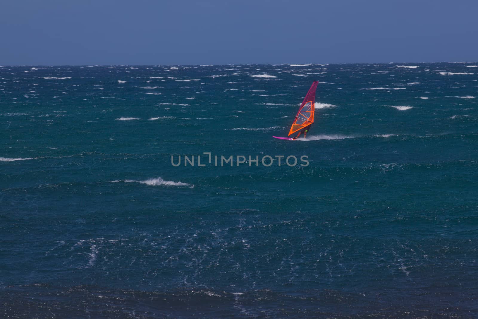 kite surfing on blue waves
