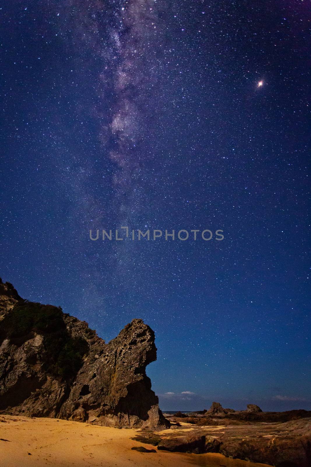 Clear starry skies and the Milky Way universe shines brightly  over Queen Victoria Rock on far south coast of NSW.