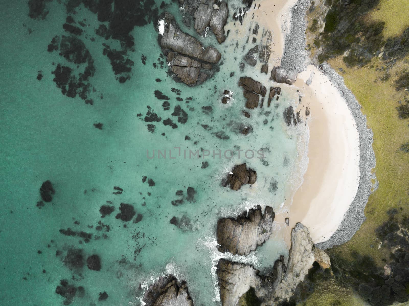 Aerial view of idyllic arc beach with pristine waters by lovleah