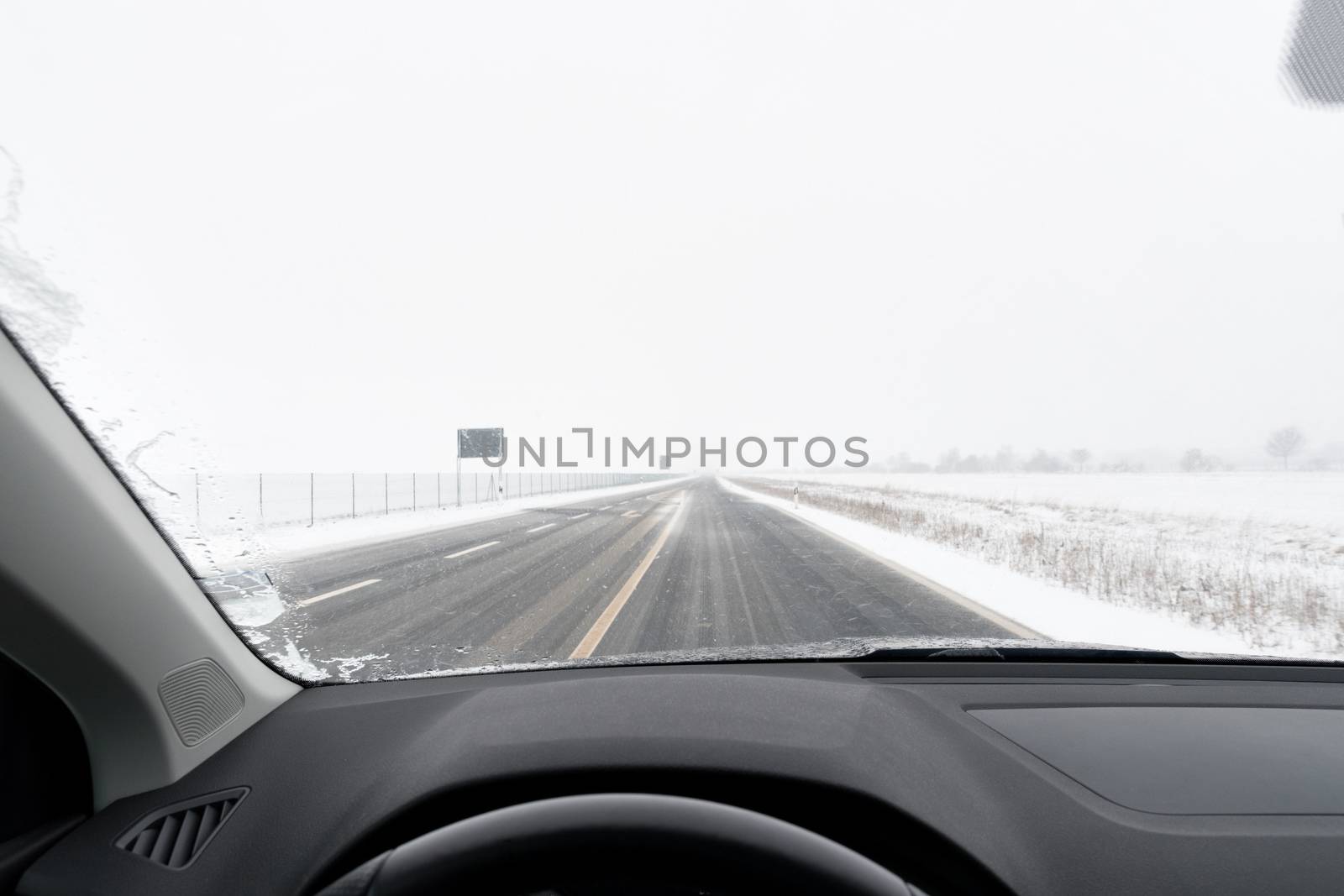 View from a car to road with snow by w20er