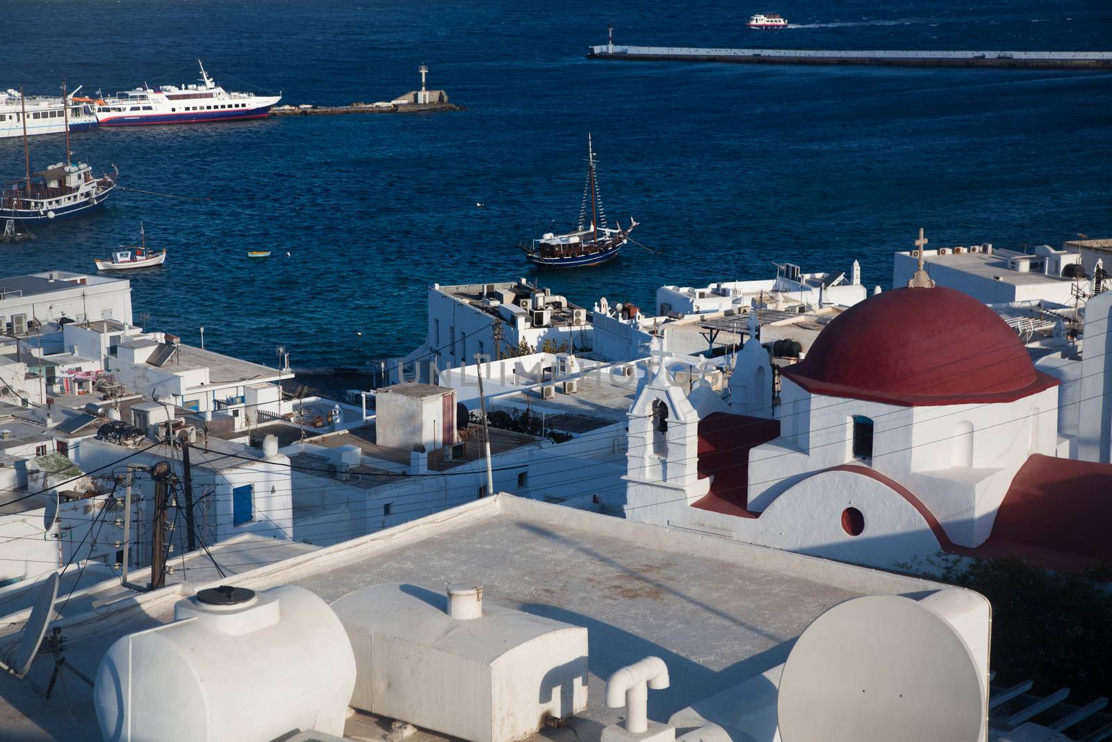 panoramic view of the Mykonos town harbor from the above hills on a sunny summer day, Mykonos, Cyclades, Greece