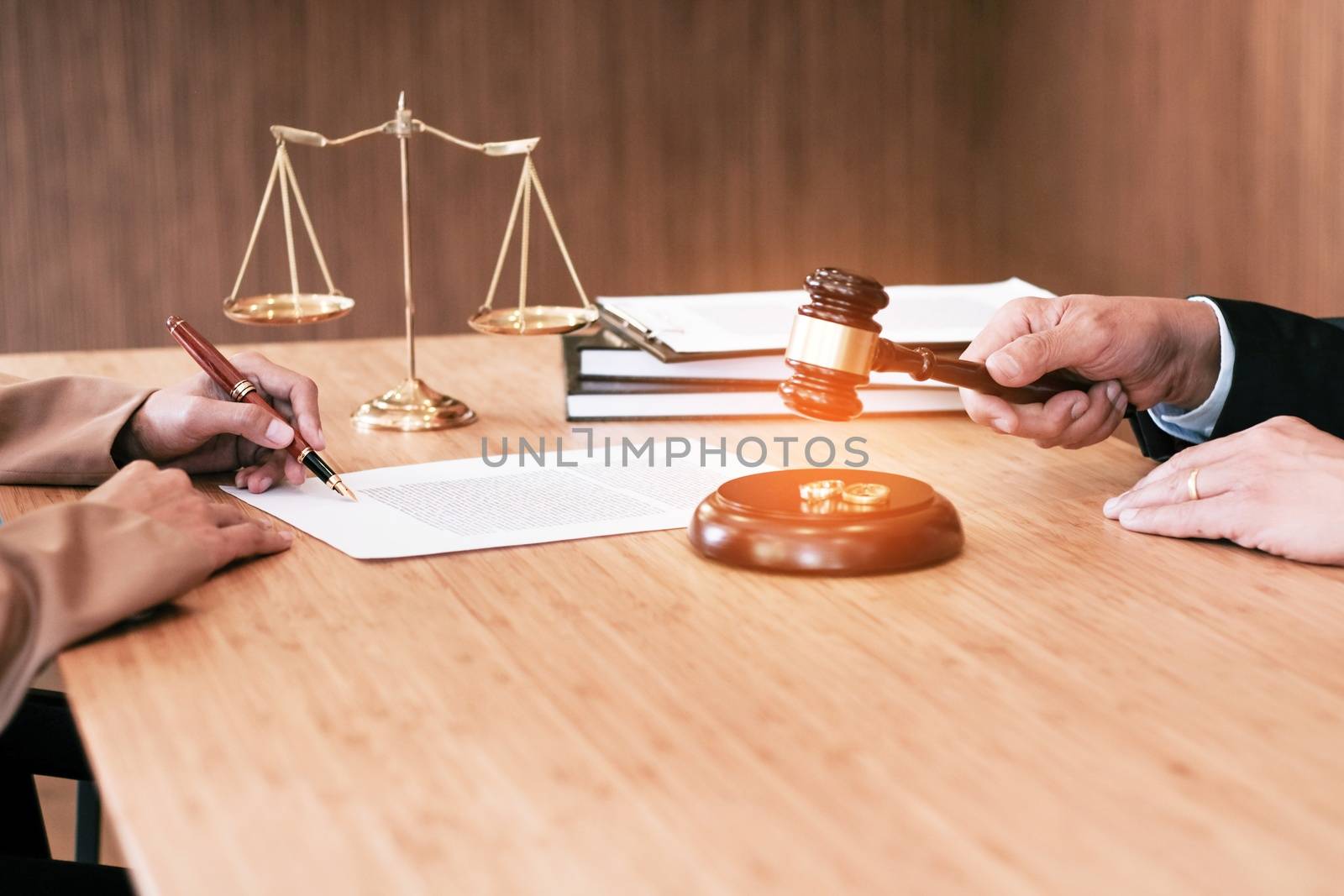 Judge gavel deciding on marriage divorce signing papers. lawyer concept