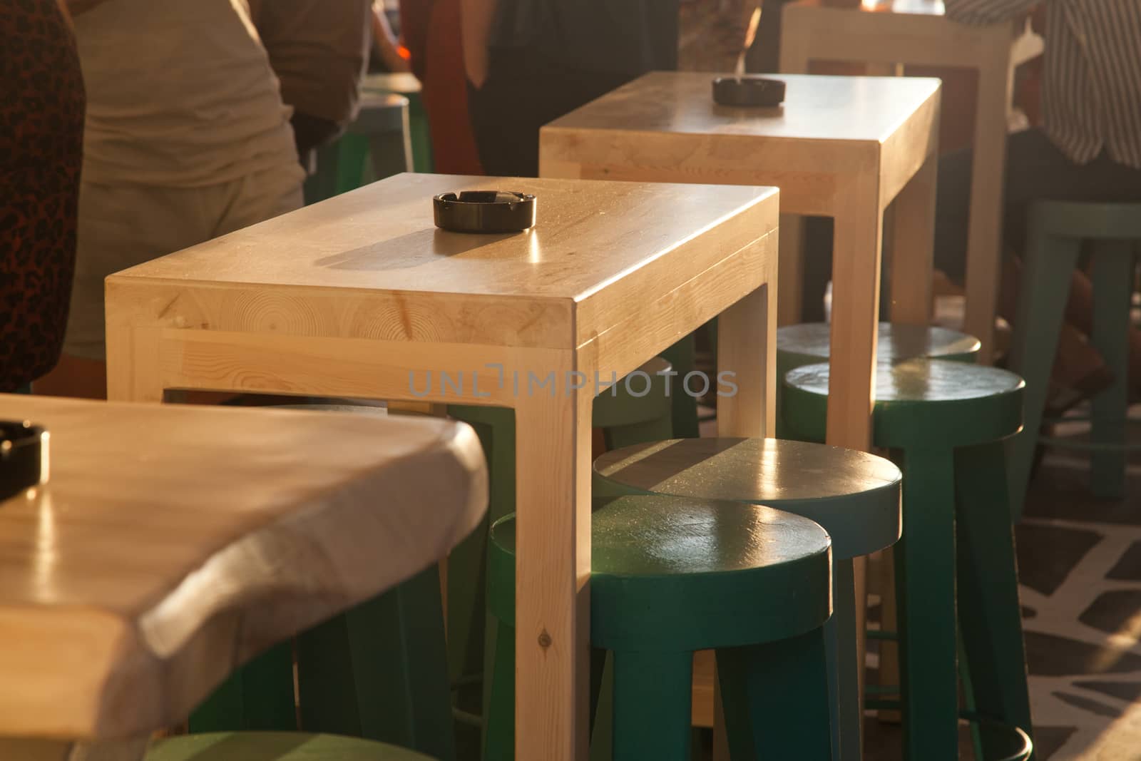 sunset bar by the beach - focus on table