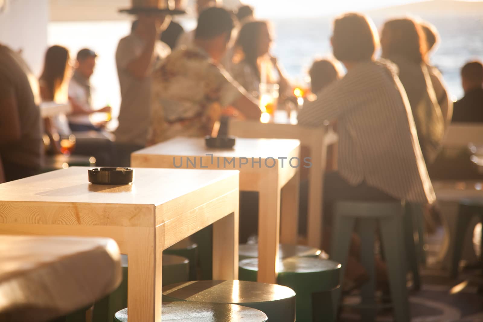 sunset bar by the beach - focus on table