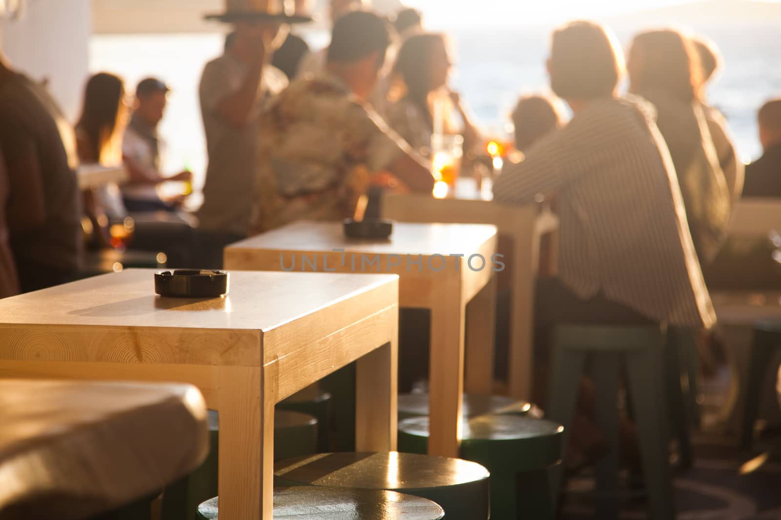 sunset bar by the beach - focus on table