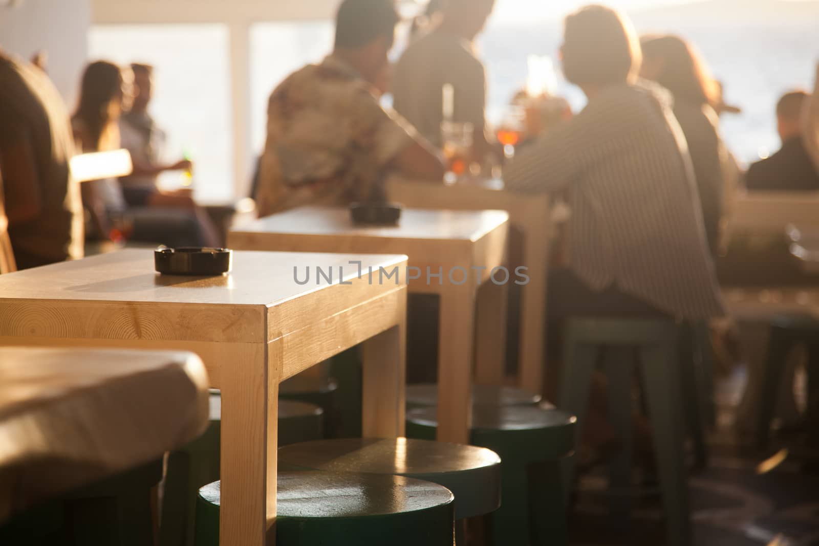 sunset bar by the beach - focus on table