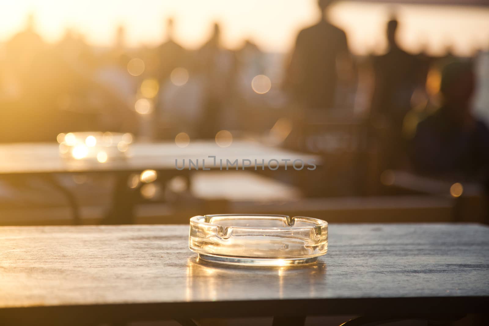 sunset bar by the beach - focus on table