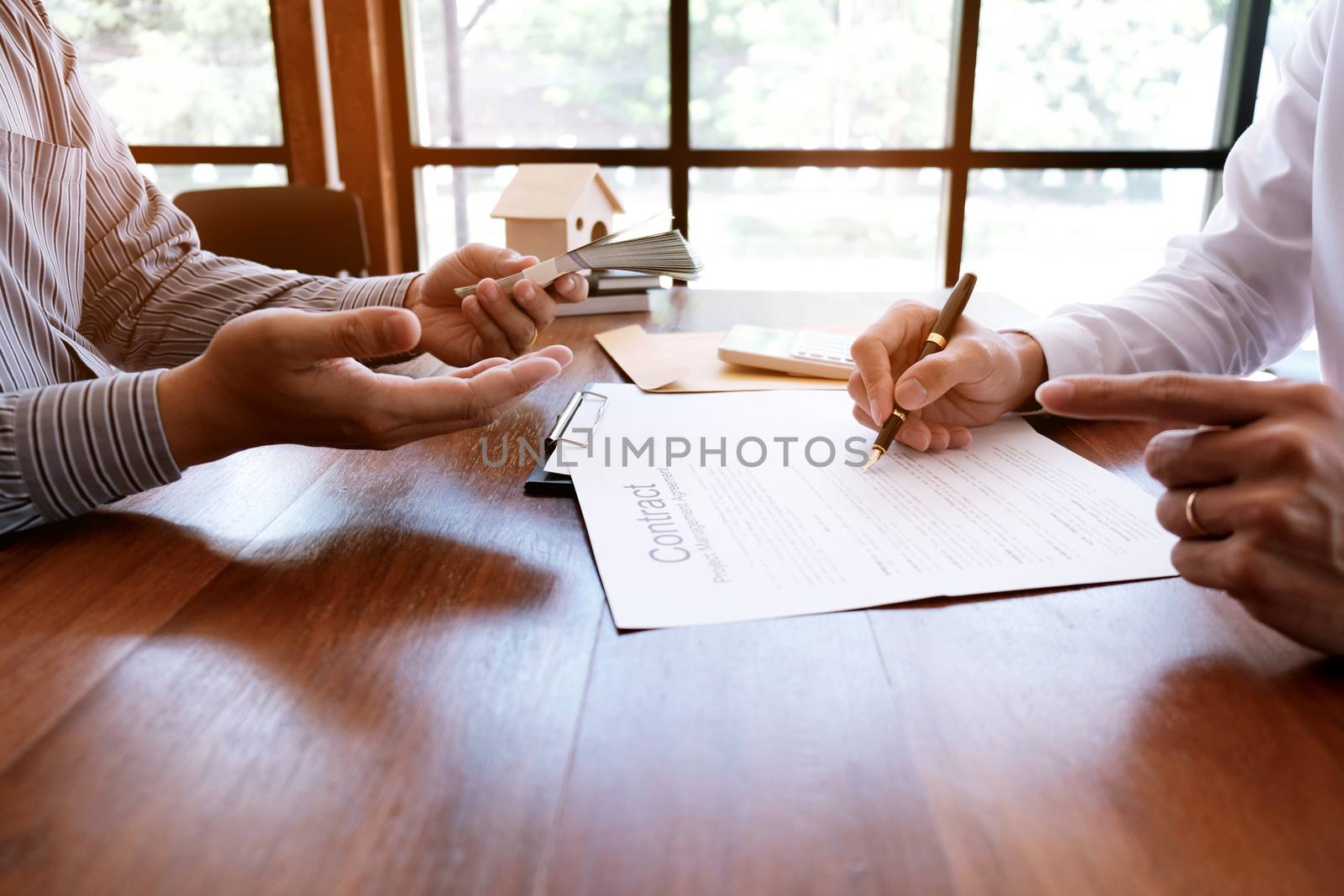 Business people signing contract making a deal with real estate agent Concept for consultant and home insurance concept