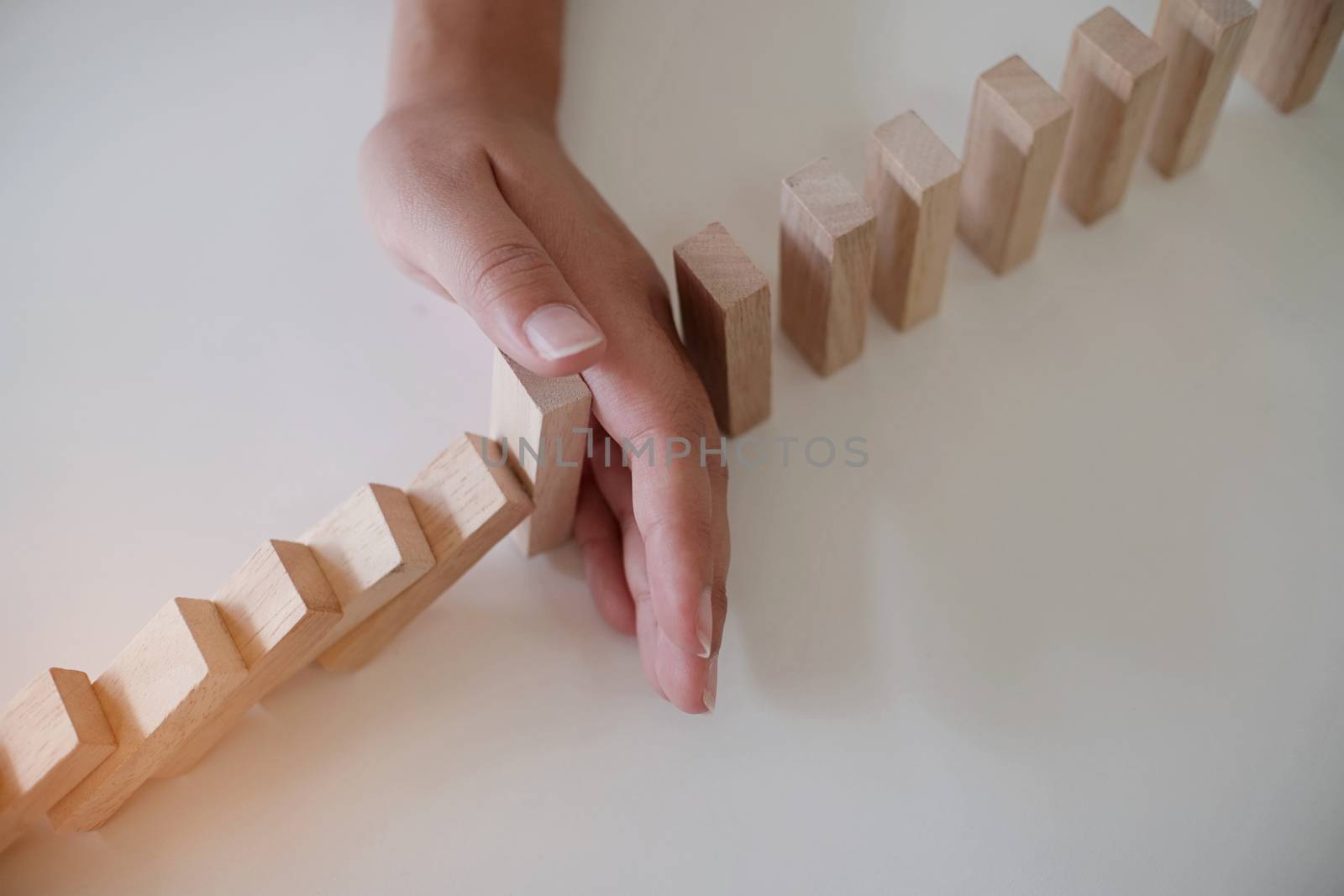 Planning risk and strategy in businessman gambling placing wooden block.Business concept for growth success process.