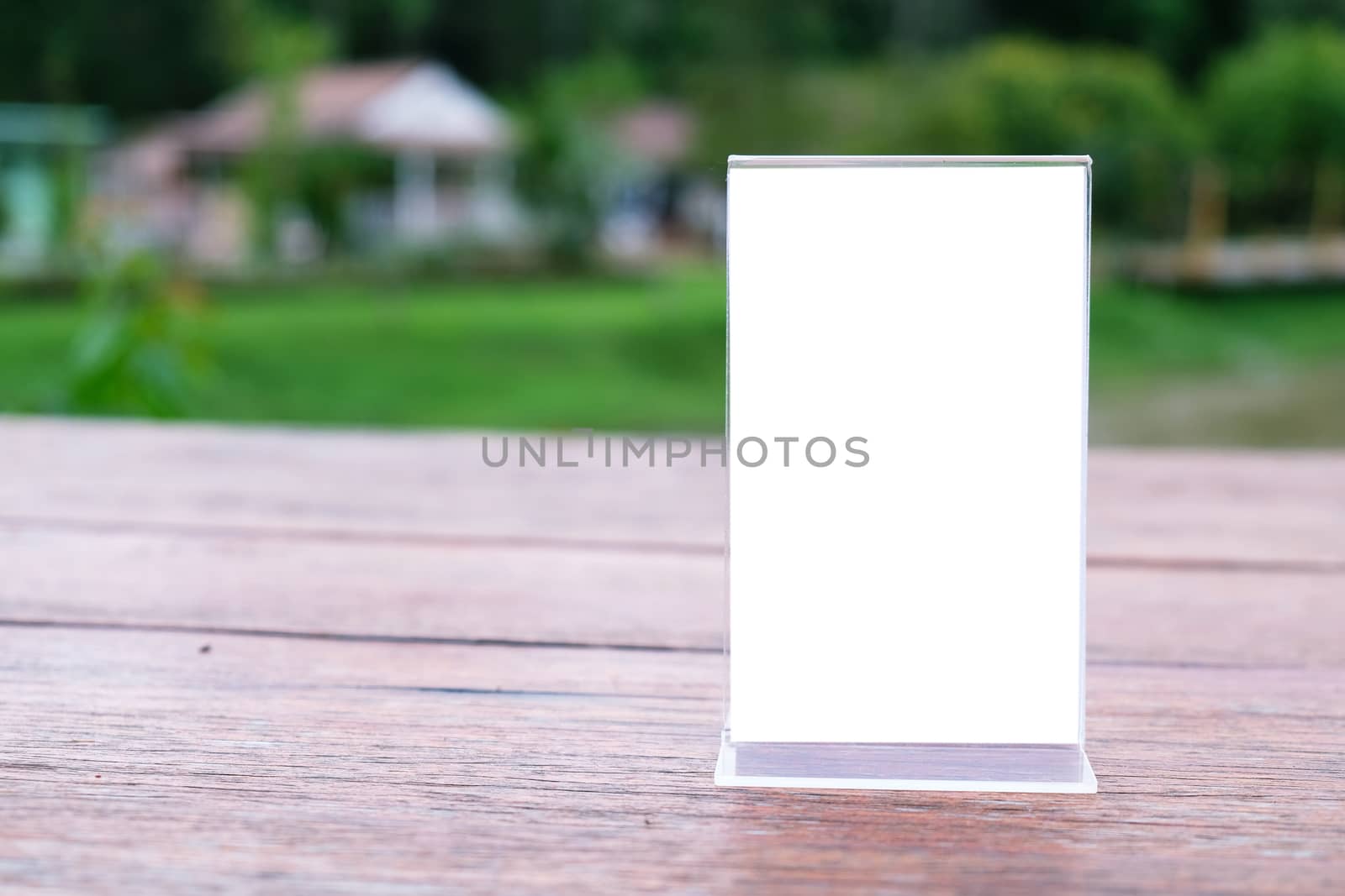 Menu frame standing on wood table in Bar restaurant cafe. space for text marketing promotion