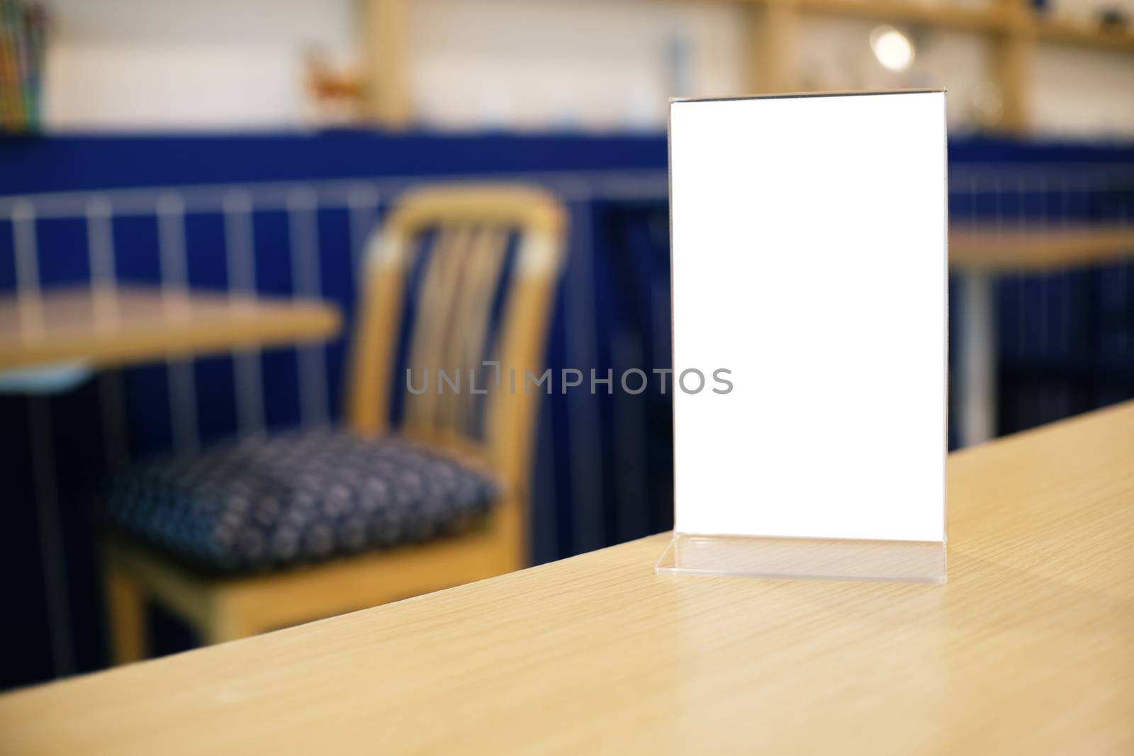 Menu frame standing on wood table in Bar restaurant cafe. space for text marketing promotion