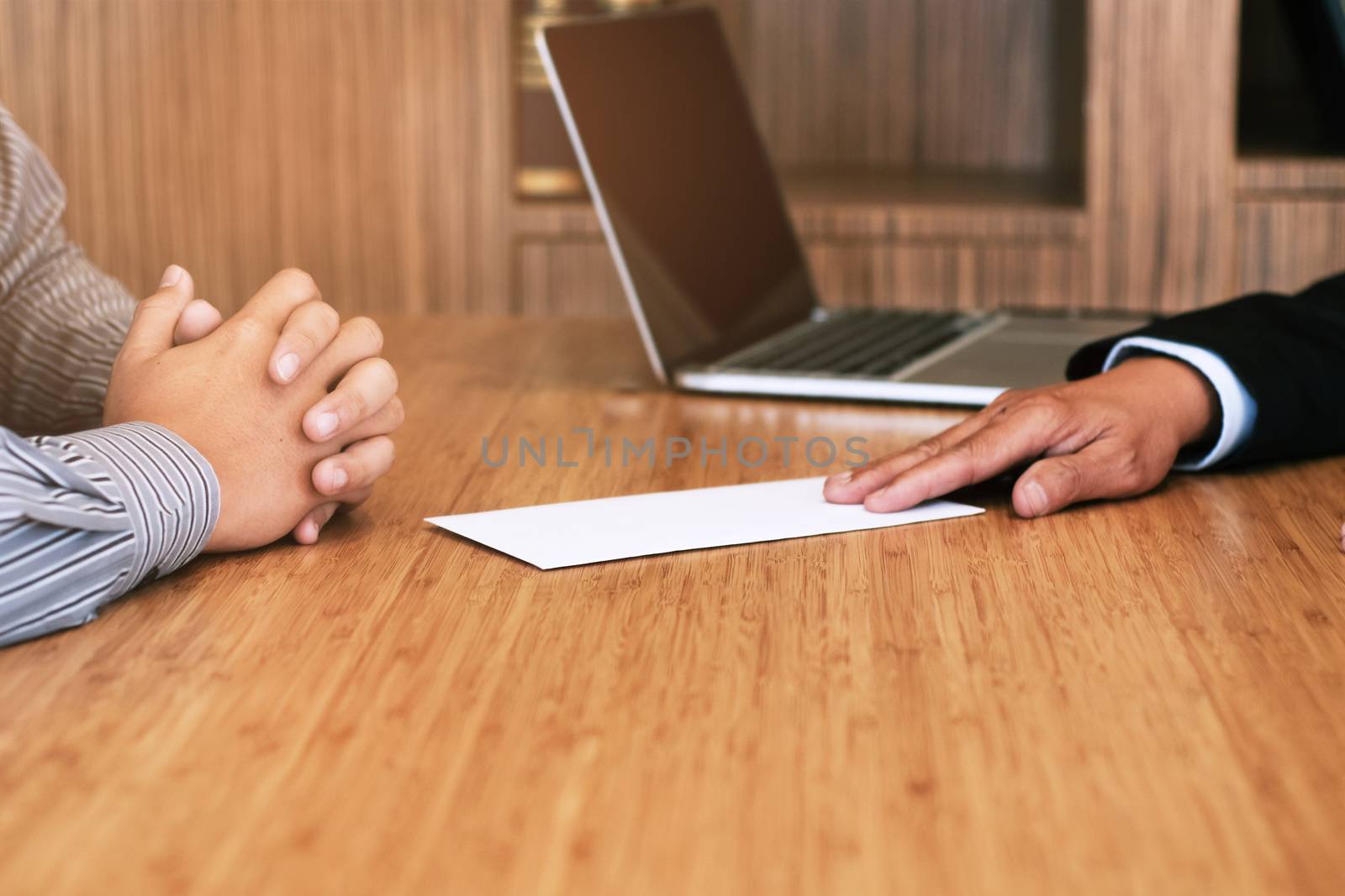 Business man sending resignation letter to boss and Holding Stuff Resign Depress or carrying cardboard box by desk in office