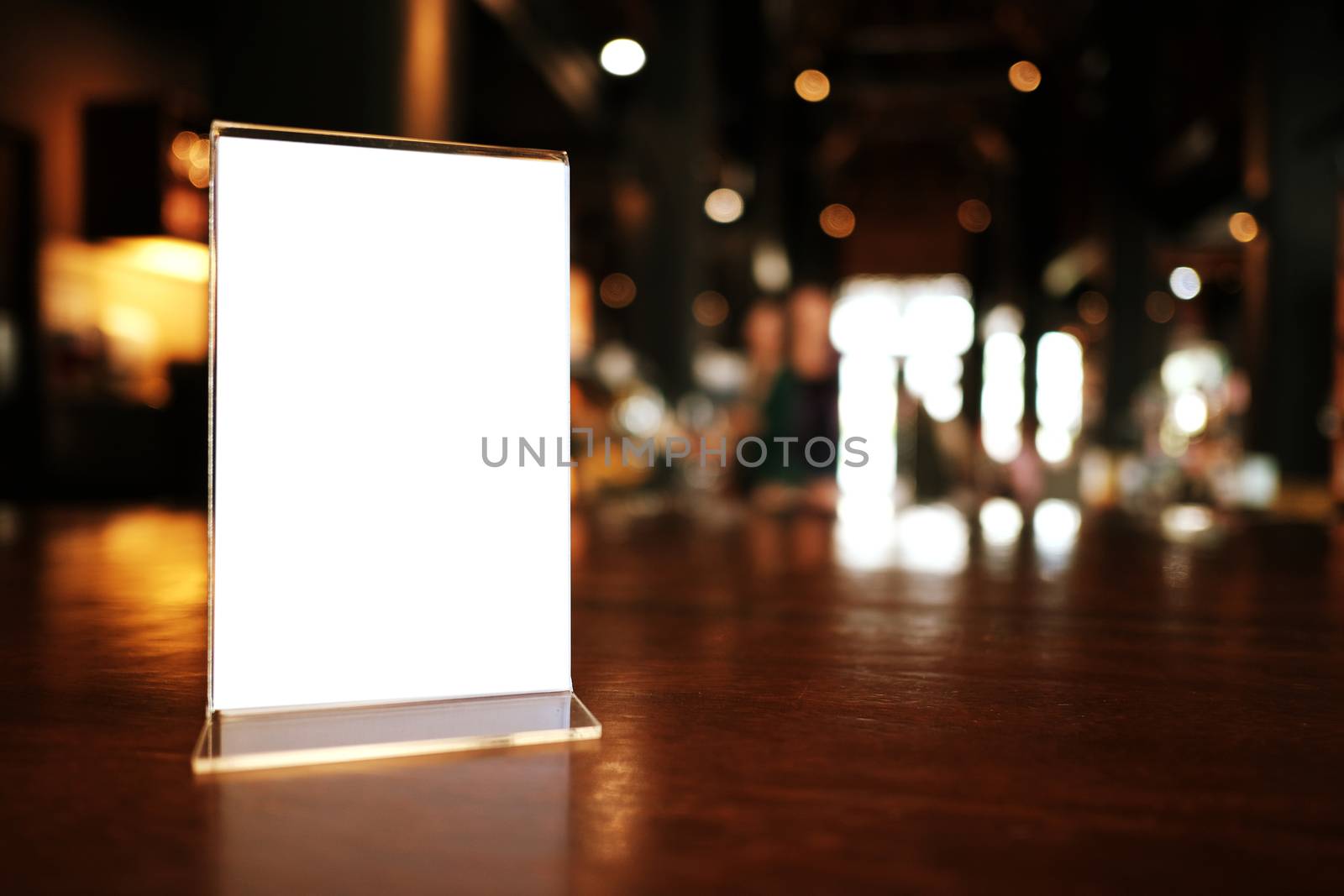 Menu frame standing on wood table in Bar restaurant cafe. space for text marketing promotion