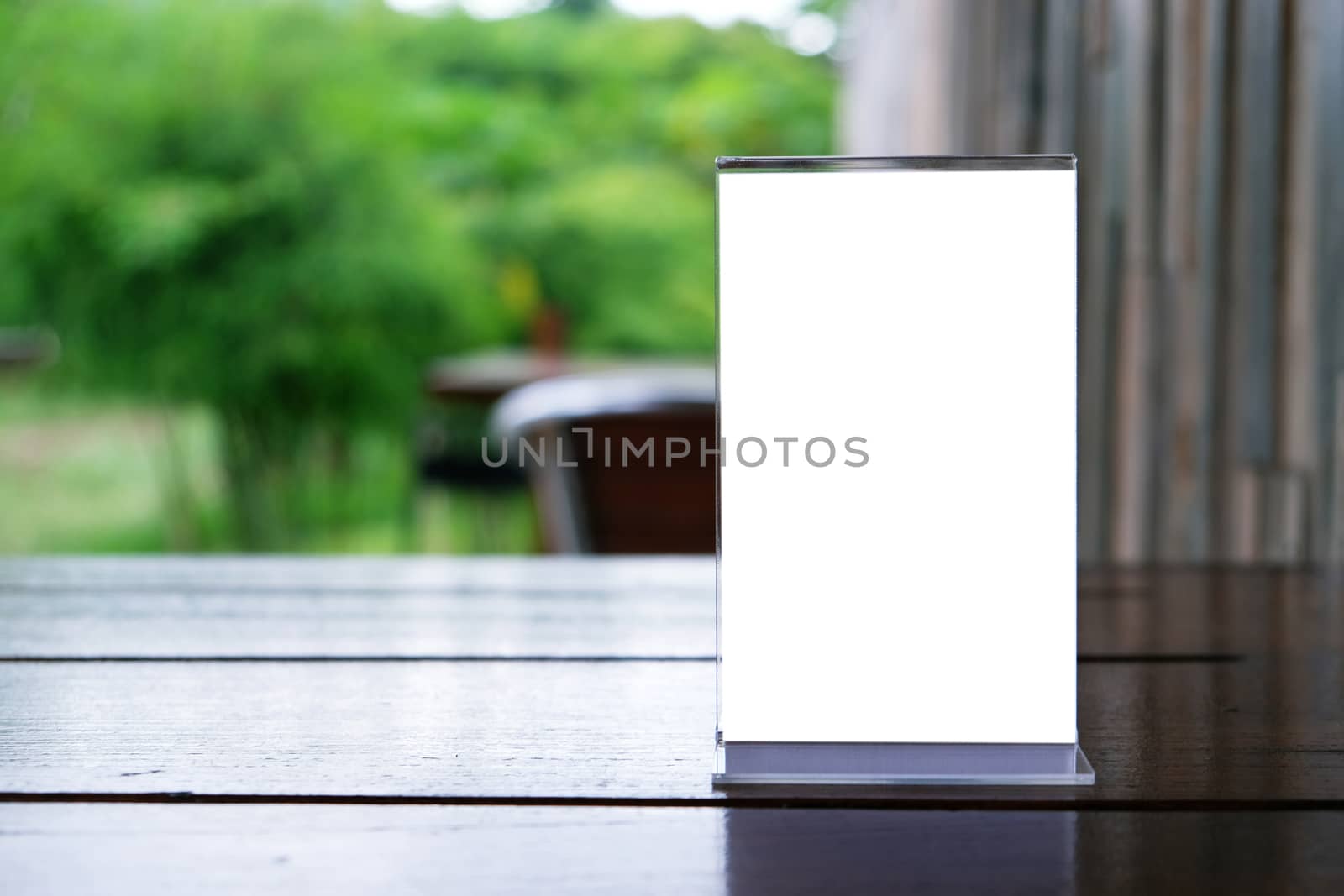 Menu frame standing on wood table in Bar restaurant cafe. space for text marketing promotion